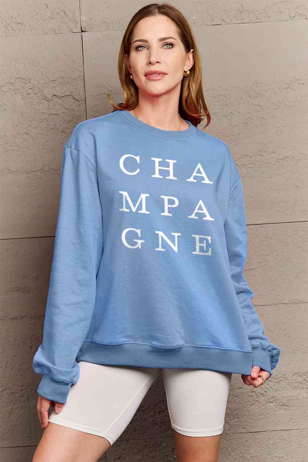CHAMPAGNE Graphic Long Sleeve Sweatshirt